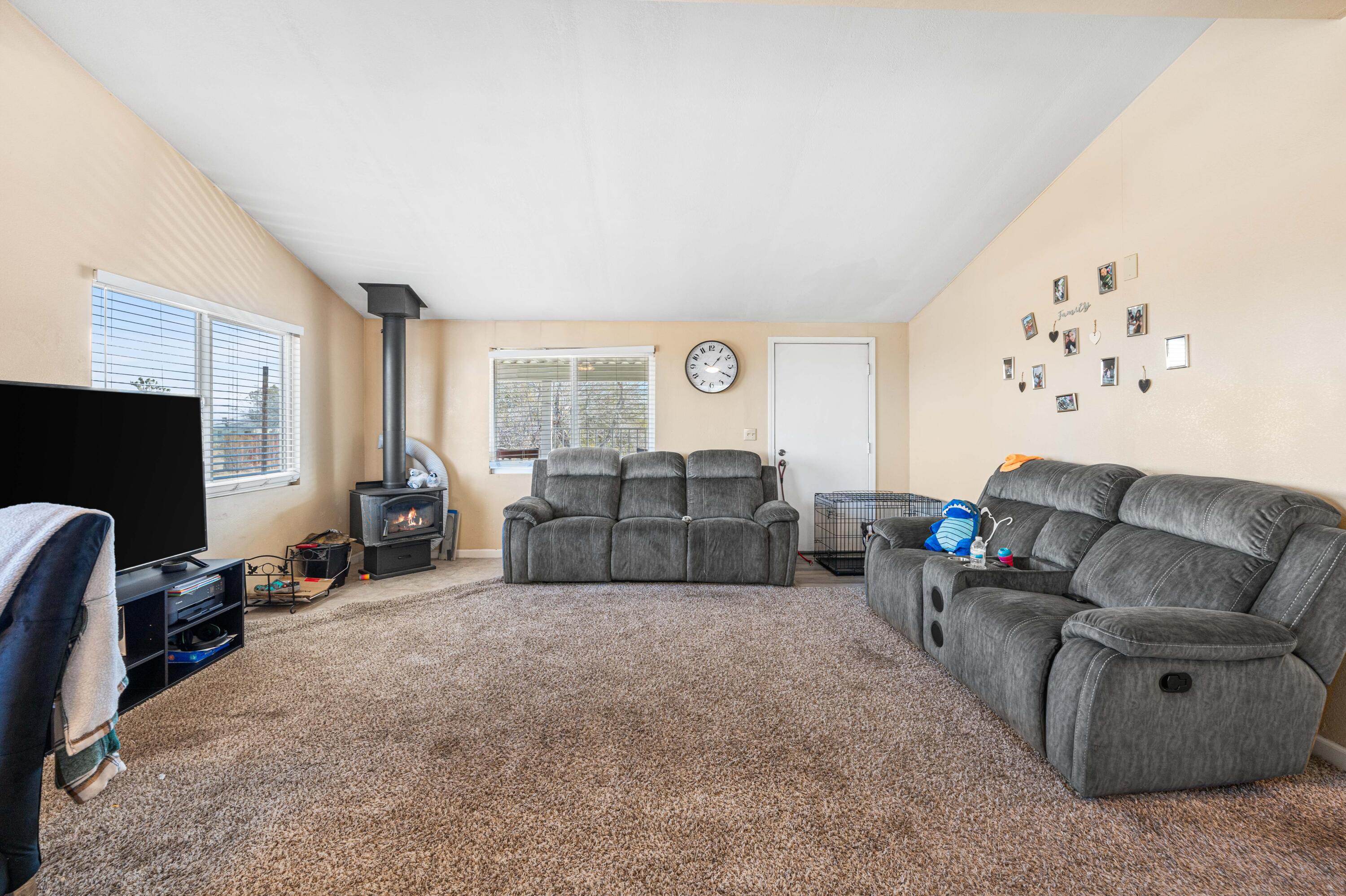 4824 Sacramento Road Phelan, CA 92371 - Photo 8 of 28 a living room with furniture and a flat screen tv