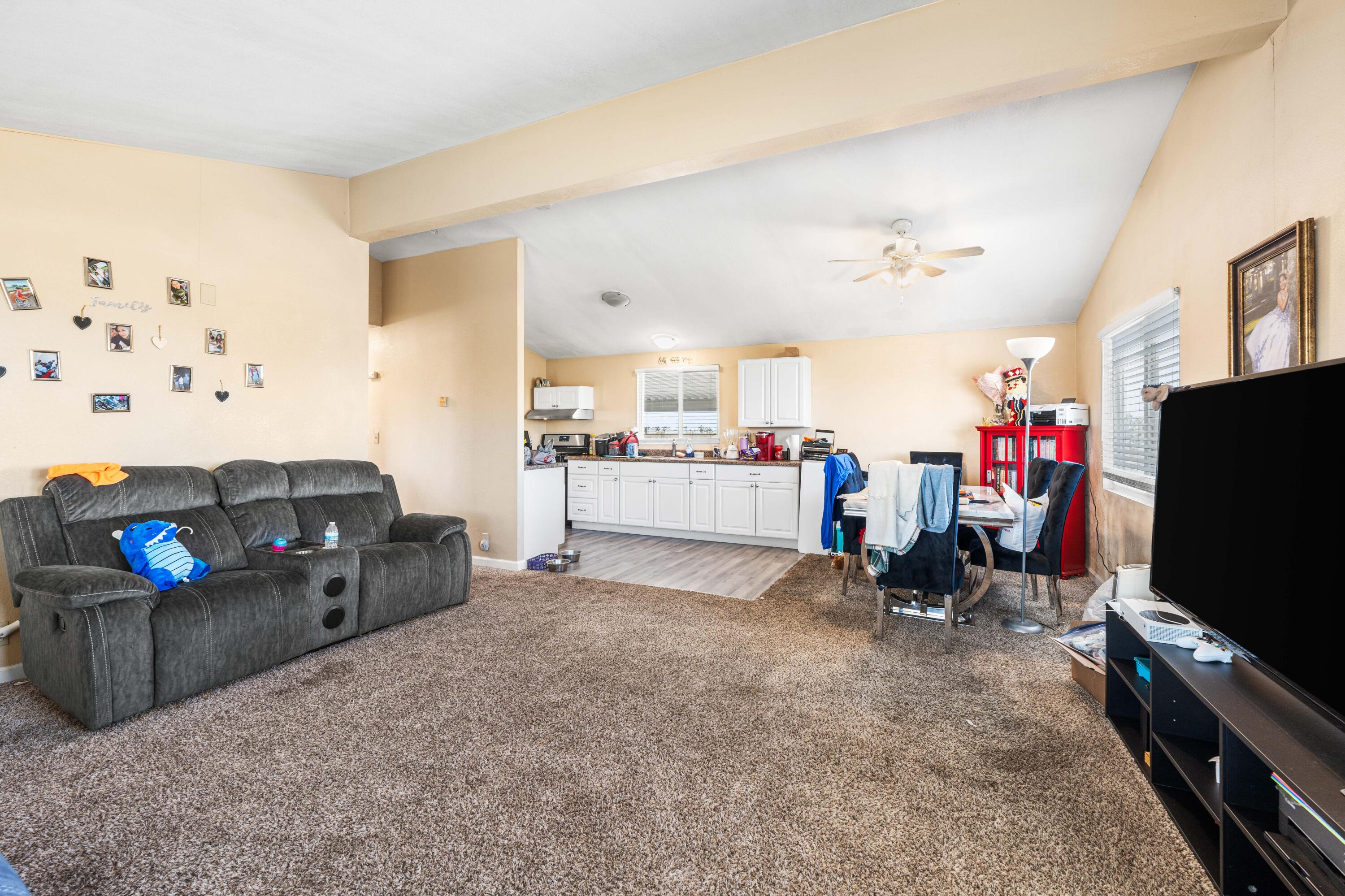4824 Sacramento Road Phelan, CA 92371 - Photo 9 of 28 a living room with furniture and a flat screen tv