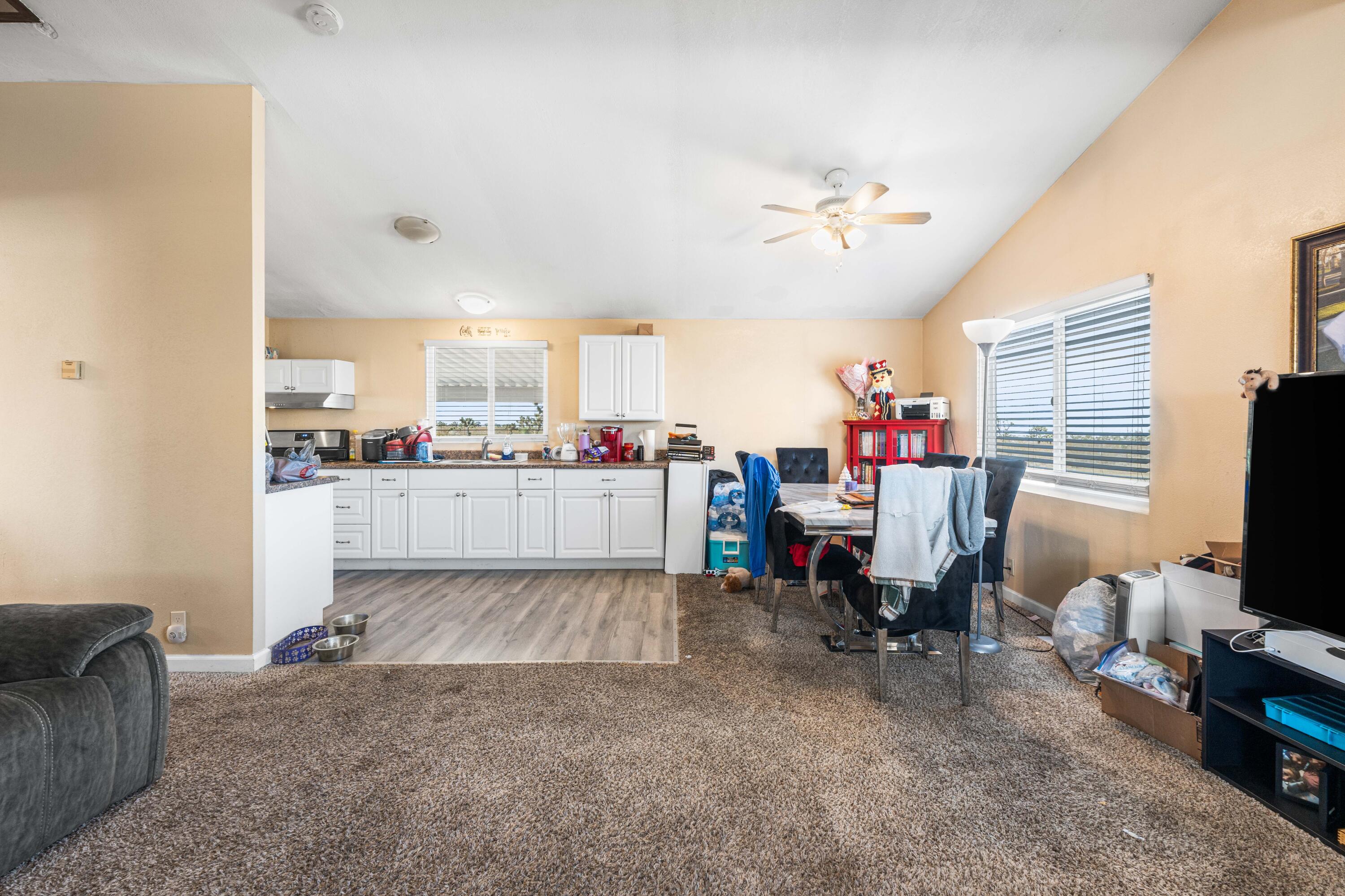 4824 Sacramento Road Phelan, CA 92371 - Photo 10 of 28 a living room filled with furniture and a flat screen tv