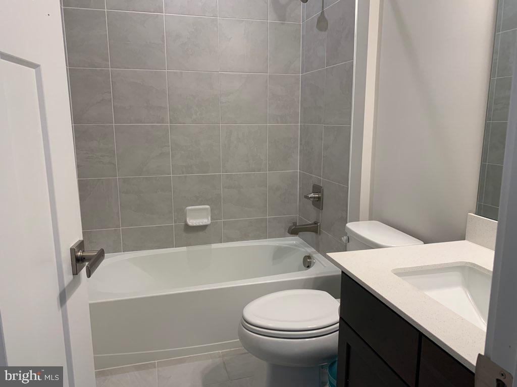 37354 Kestrel Way Ocean View, DE 19970 - Photo 11 of 18 a bathroom with a sink a toilet and bathtub