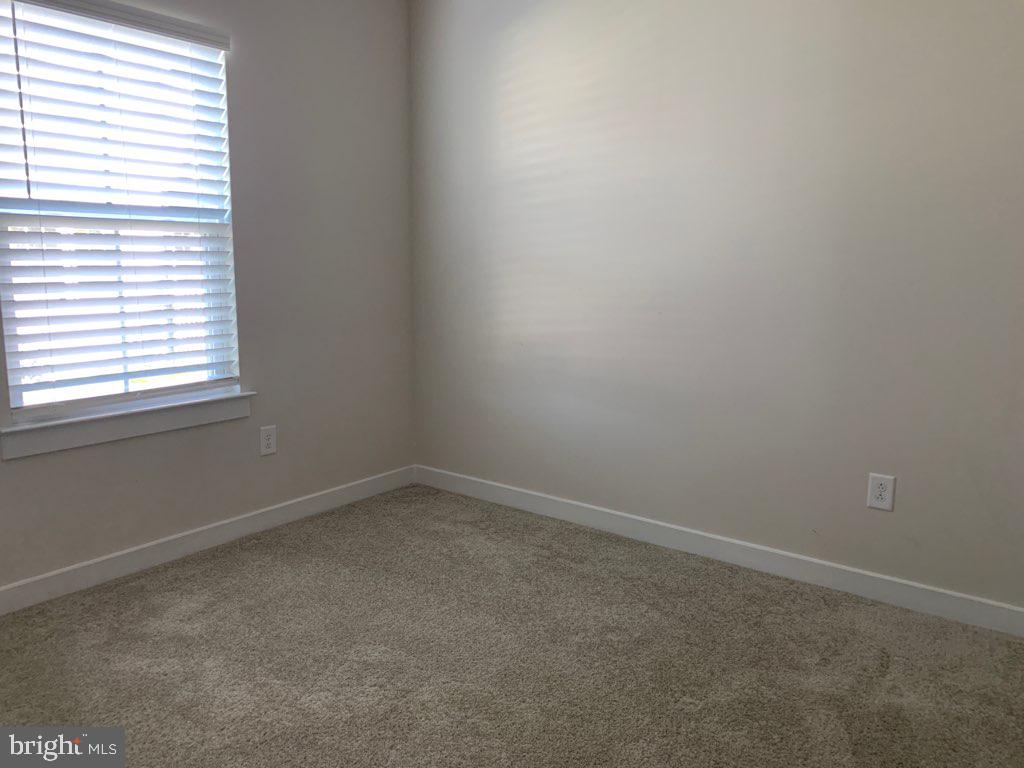 37354 Kestrel Way Ocean View, DE 19970 - Photo 12 of 18 an empty room with a window