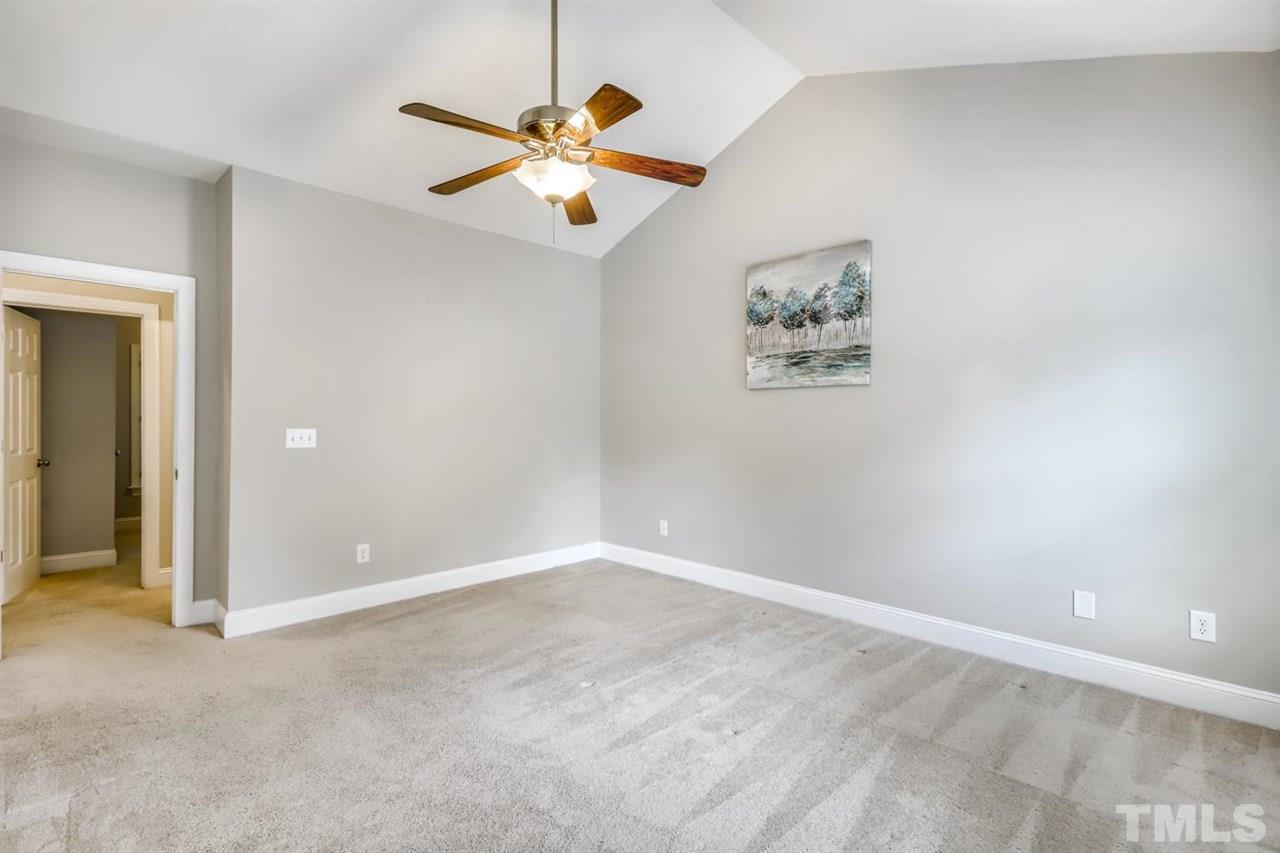 5205 Covington Bend Drive Raleigh, NC 27613 - Photo 6 of 16 Lots of privacy in the owners suite. Vaulted ceilings and a huge walk in closet for all your storage needs!