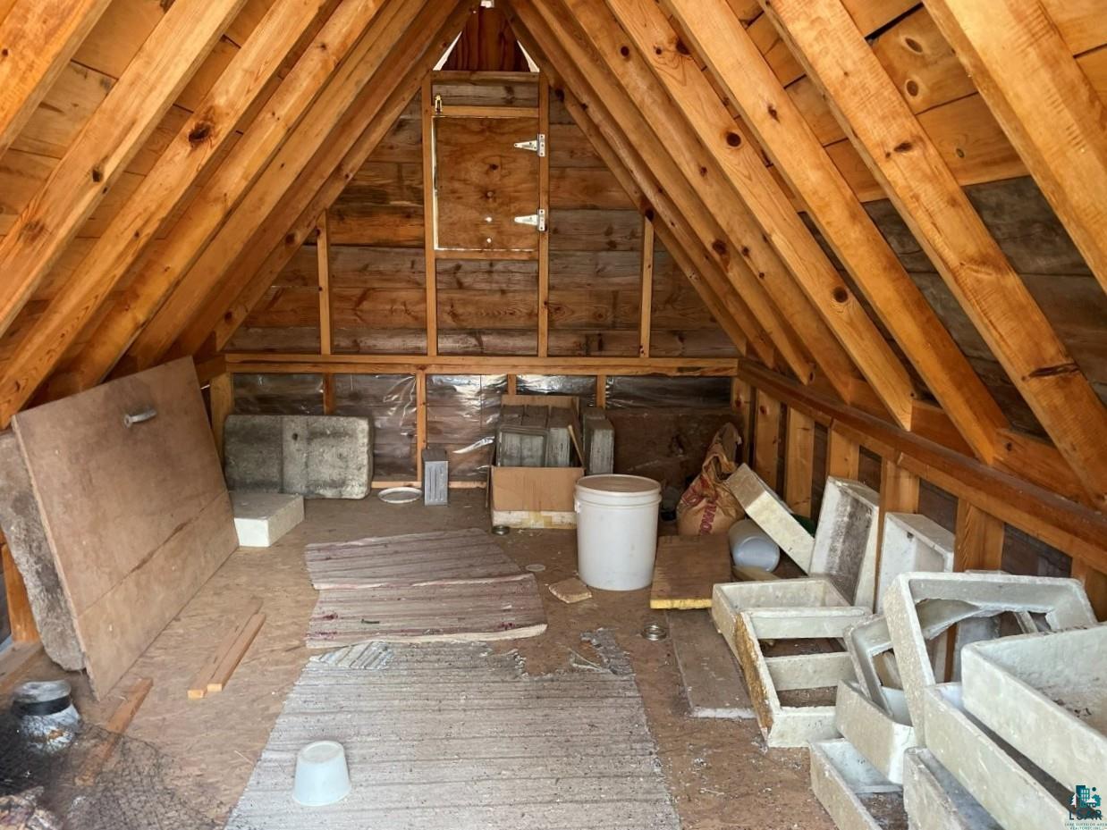 1480 Maijala Road Ely, MN 55731 - Photo 54 of 58 Exposed wooden roof trusses and wall framing