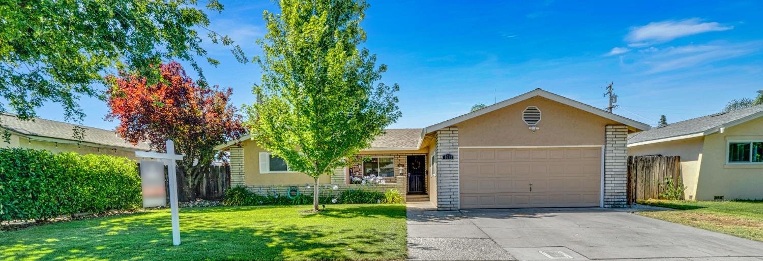 1612 Angelene Drive Modesto, CA 95355 - Photo 1 of 1 a front view of house with yard and green space