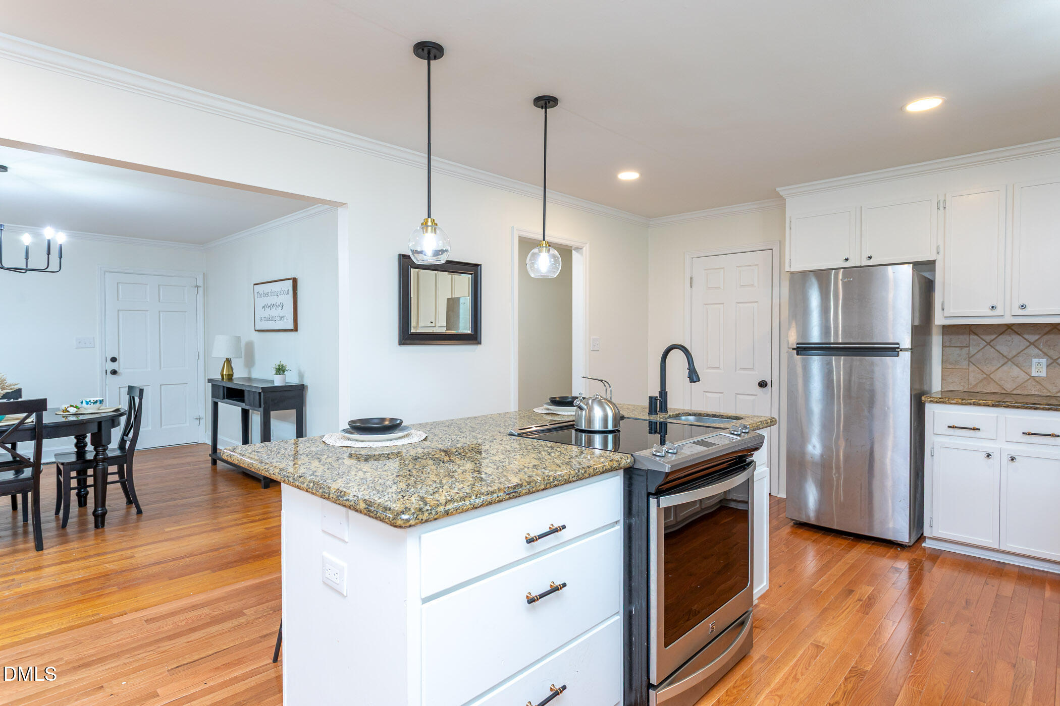 641 Rocky Ford Road Louisburg, NC 27549 - Photo 11 of 40 a kitchen with stainless steel appliances granite countertop a refrigerator a stove a sink dishwasher and a wooden cabinets