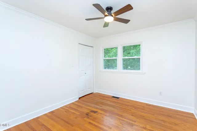 a bathroom with a sink mirror and toilet