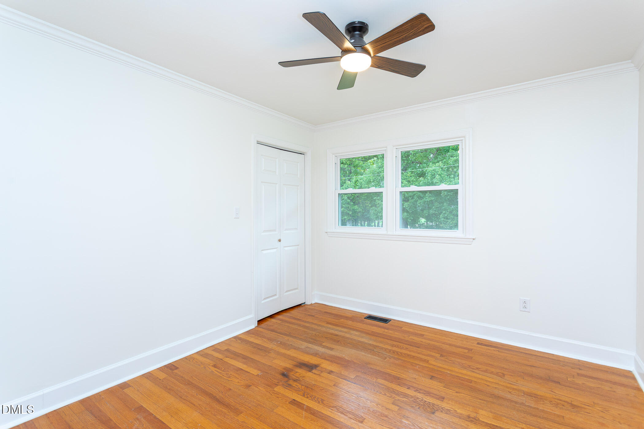 641 Rocky Ford Road Louisburg, NC 27549 - Photo 23 of 40 an empty room with a window and a fan