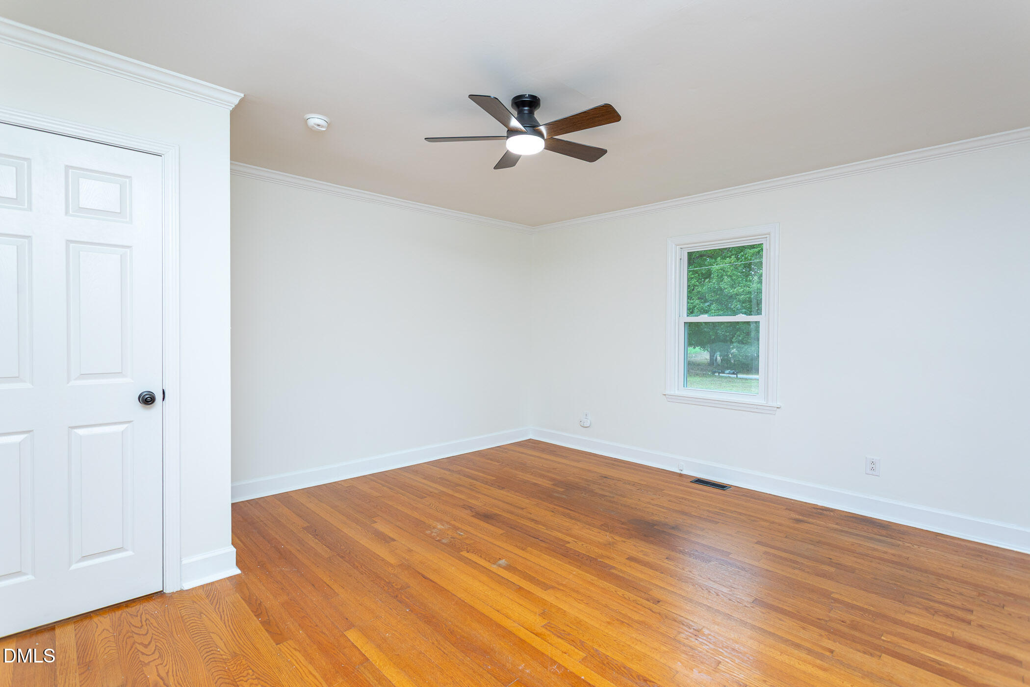641 Rocky Ford Road Louisburg, NC 27549 - Photo 27 of 40 a view of a big room with wooden floor and windows