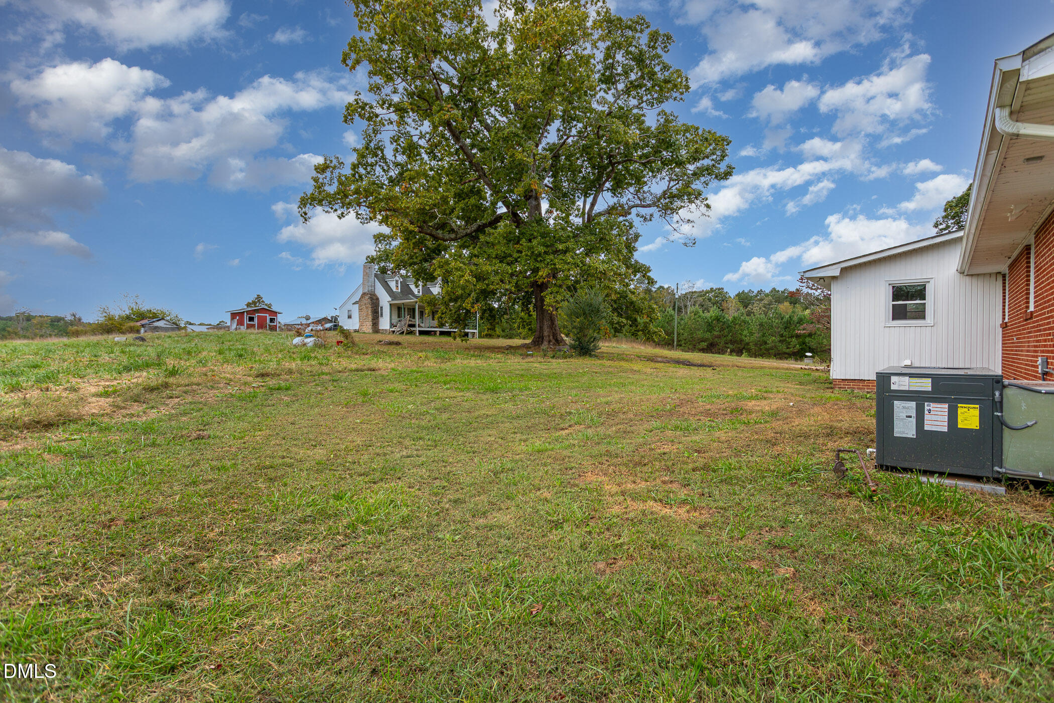 641 Rocky Ford Road Louisburg, NC 27549 - Photo 31 of 40 a backyard of a house with lots of green space