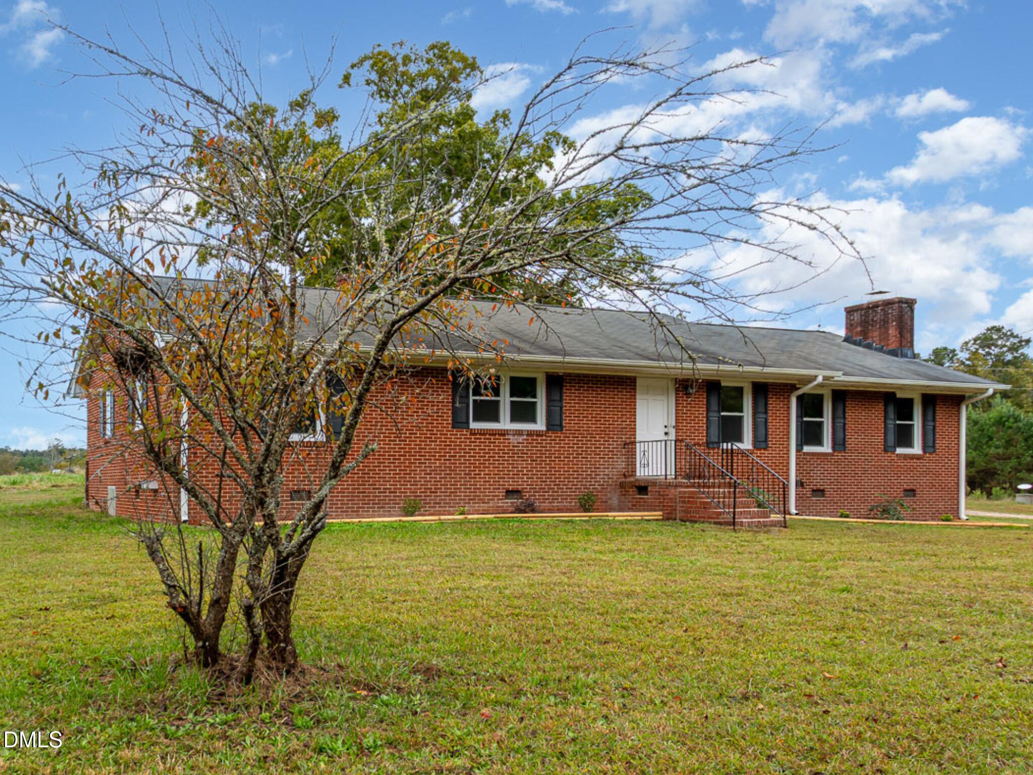 641 Rocky Ford Road Louisburg, NC 27549 - Photo 32 of 40 a front view of a house with garden