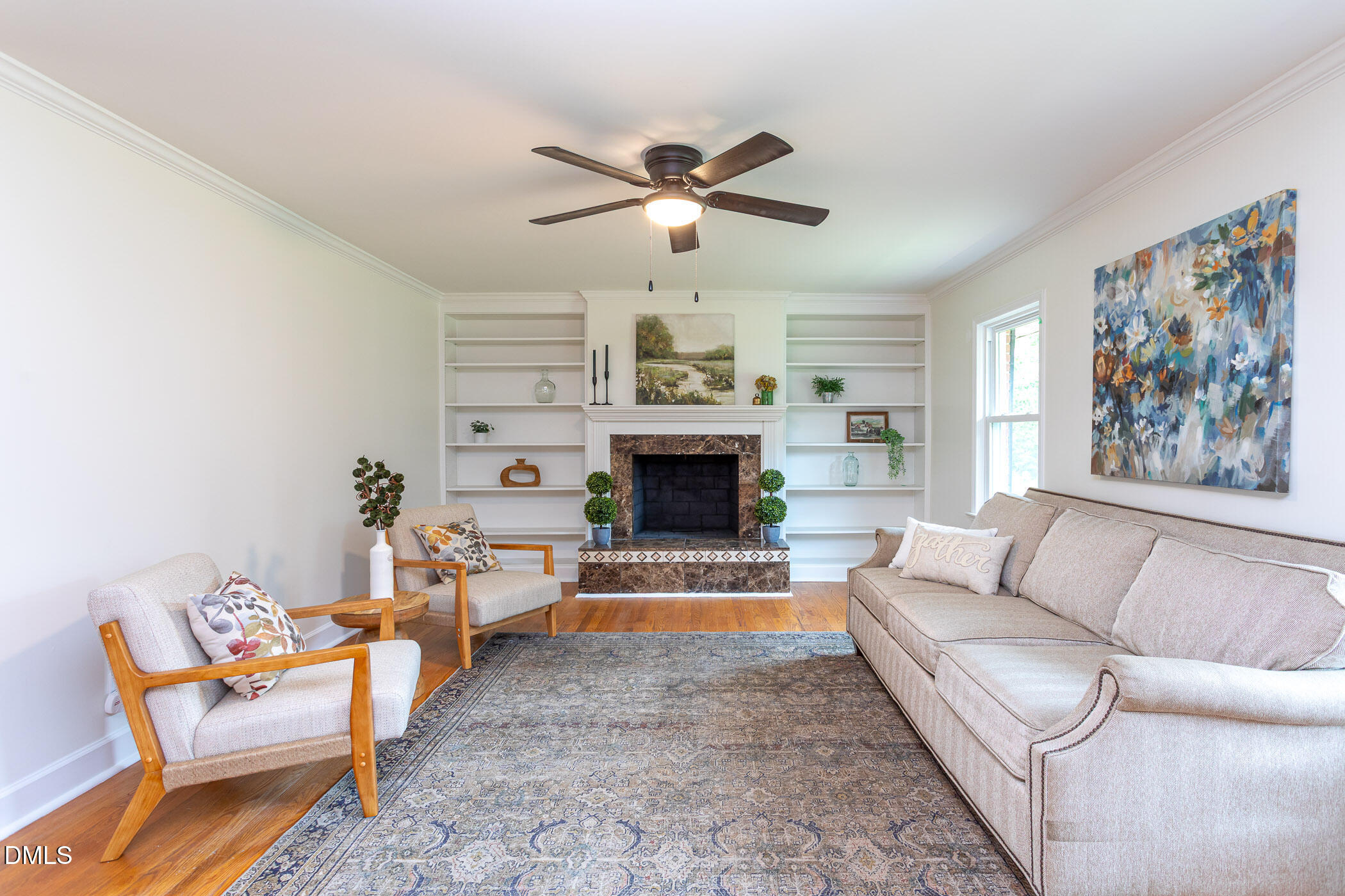 641 Rocky Ford Road Louisburg, NC 27549 - Photo 4 of 40 a living room with furniture a fireplace and a ceiling fan