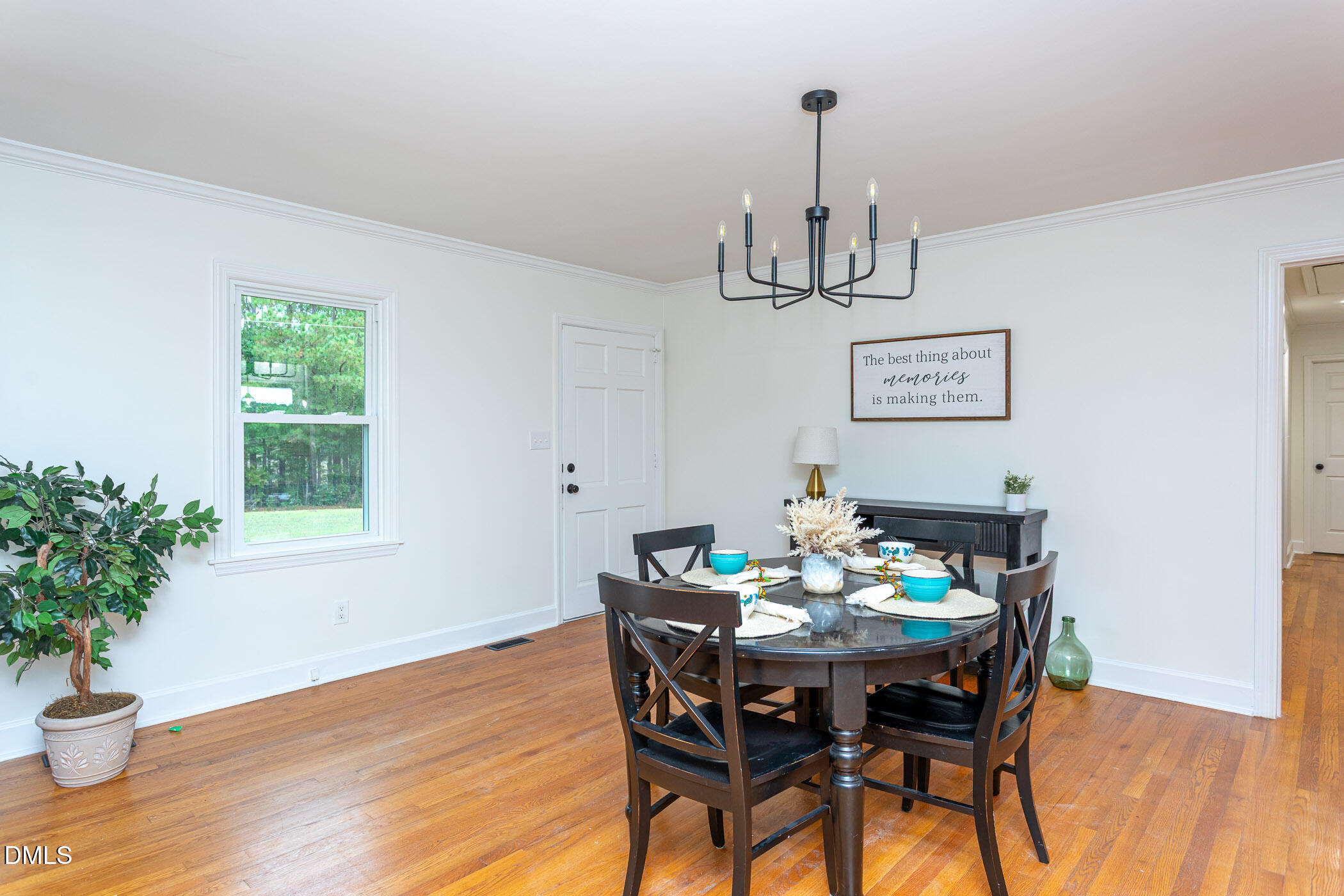 641 Rocky Ford Road Louisburg, NC 27549 - Photo 9 of 40 a view of a dining room with furniture window and wooden floor