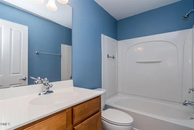 a bathroom with a sink a toilet and a bathtub