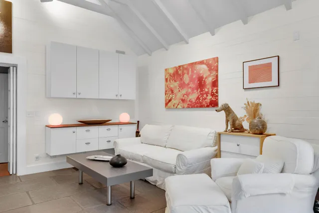 a bedroom with a large bed and a large window