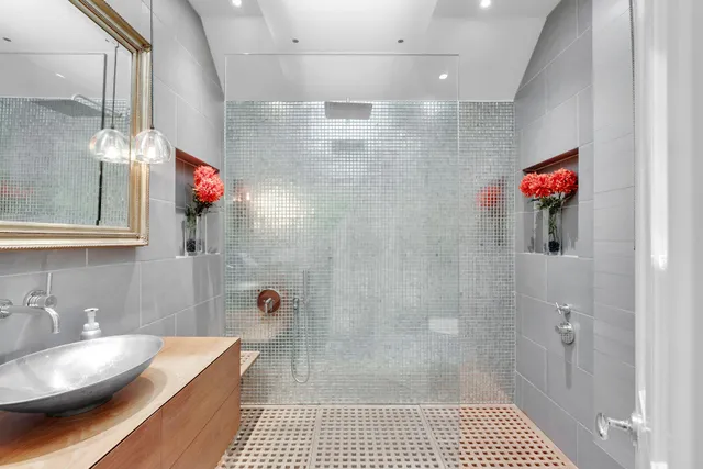 a living room with furniture a flat screen tv and a table