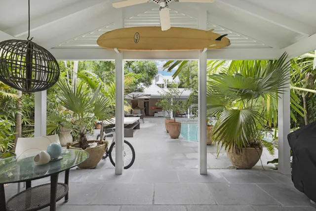 a bathroom with a sink shower and a mirror