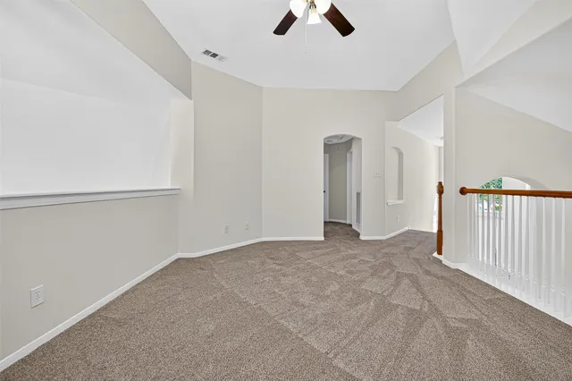 a bathroom with a sink a toilet and a large mirror