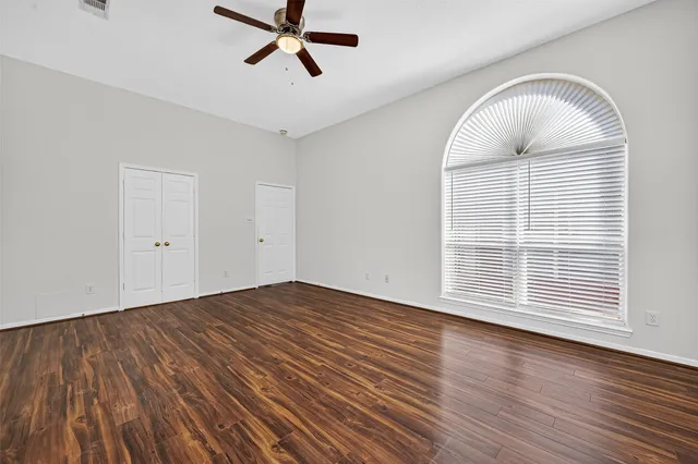a spacious bathroom with a tub shower and sink