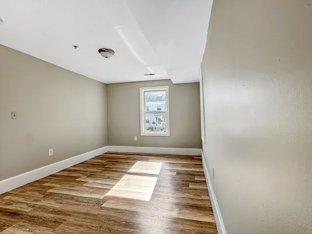 a view of an empty room and window