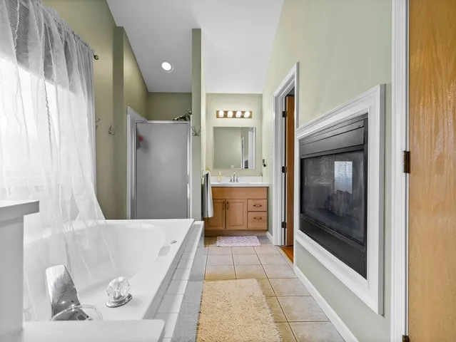 a bathroom with a bathtub and a shower