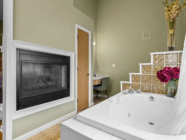 a bathroom with a tub and shower