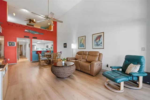 a bedroom with a bed and painting on the wall