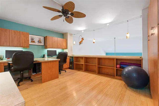 a view of house with backyard and seating area