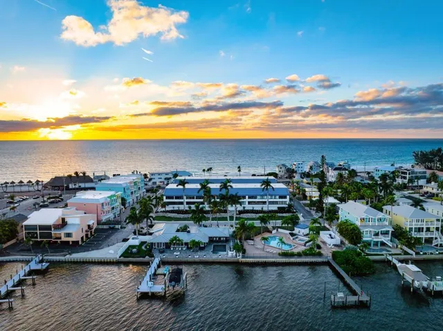 a living room with furniture and large windows