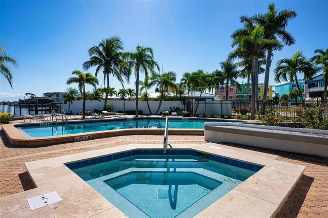 a kitchen with cabinets stainless steel appliances and a counter space