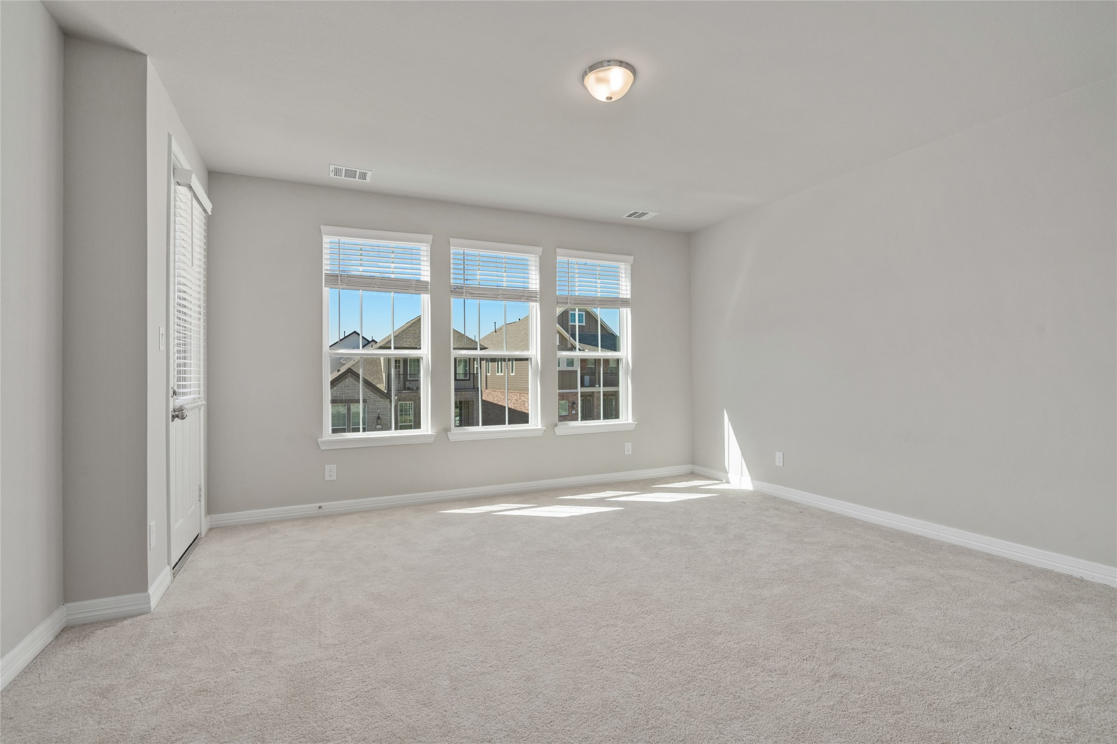 9406 Caddo Ridge Lane Cypress, TX 77433 - Photo 8 of 25 The spacious primary bedroom sits at the front of the home. The neutral pallette is perfect for adding your own touches.
