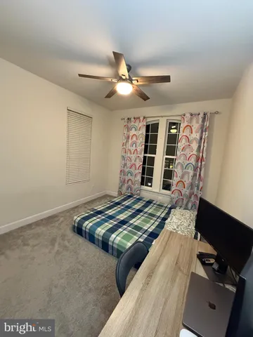 a view of bedroom with furniture and chandelier