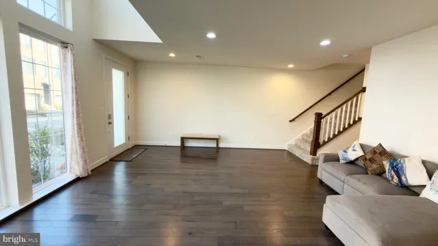 a view of an entryway with wooden floor