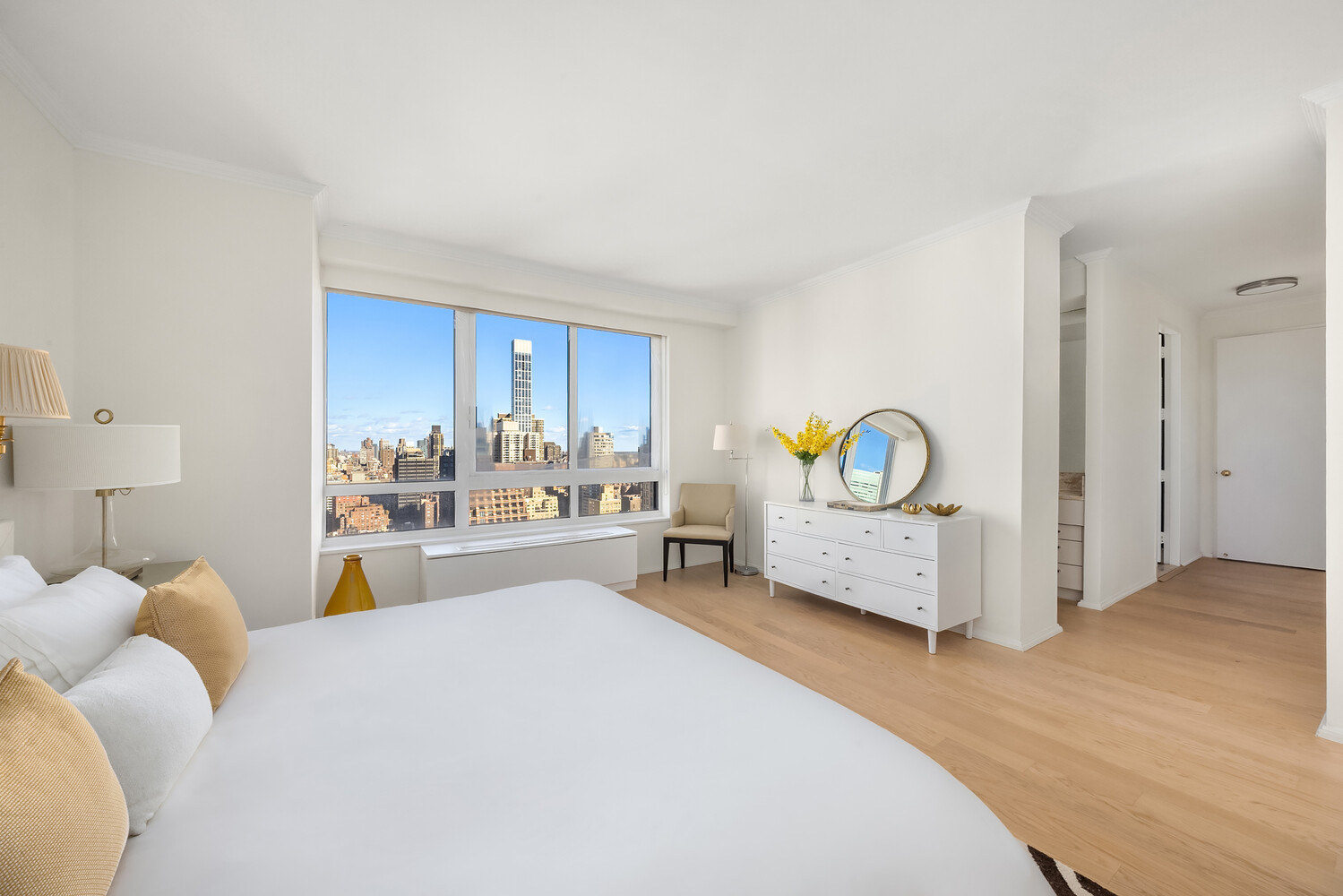 100 United Nations Plaza, Unit 35E Manhattan, NY 10017 - Photo 6 of 11 a bedroom with a bed and a cabinets