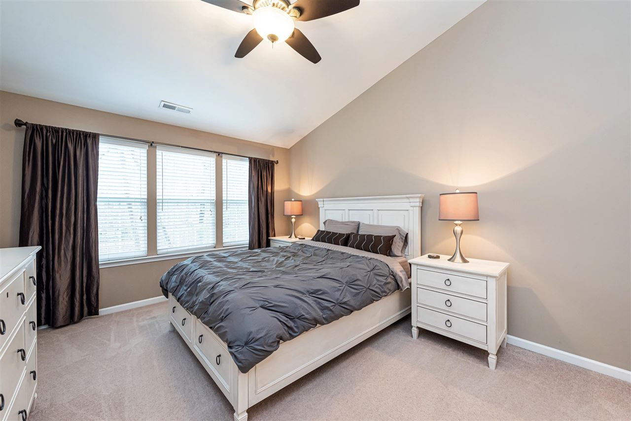 7749 Winners Edge Street Raleigh, NC 27617 - Photo 10 of 29 Master Bedroom features triple windows for lots of light, ceiling fan, and HIS/HERs closets. Master Bedroom