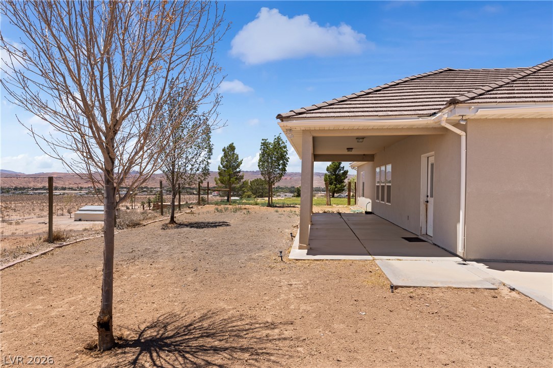 575 Gann Avenue Logandale, NV 89021 - Photo 54 of 75 A spacious covered patio invites relaxation with panoramic landscape views.