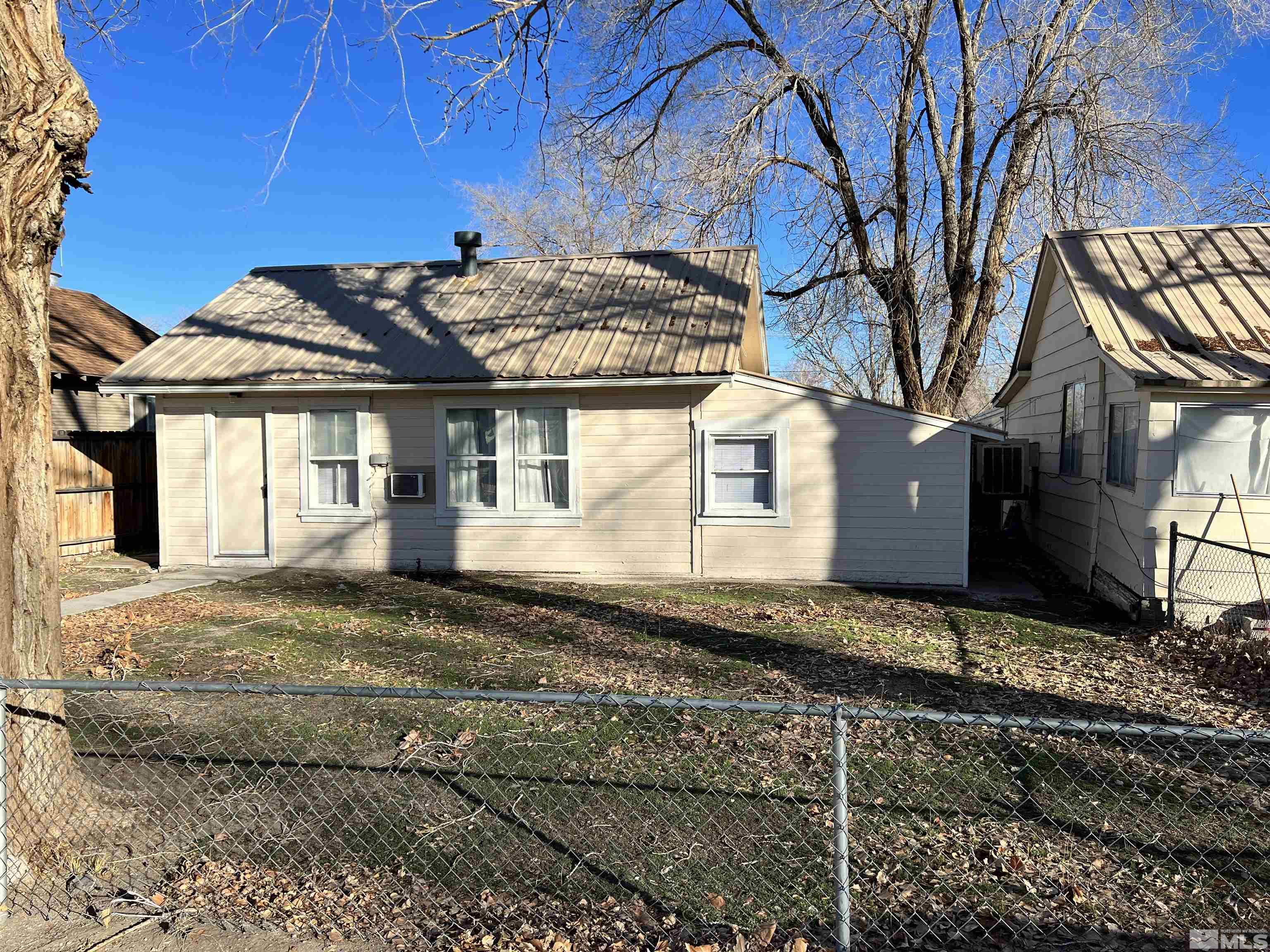 220 South Nevada Street, Unit 3 Yerington, NV 89447 - Photo 13 of 39 a view of a house with a yard
