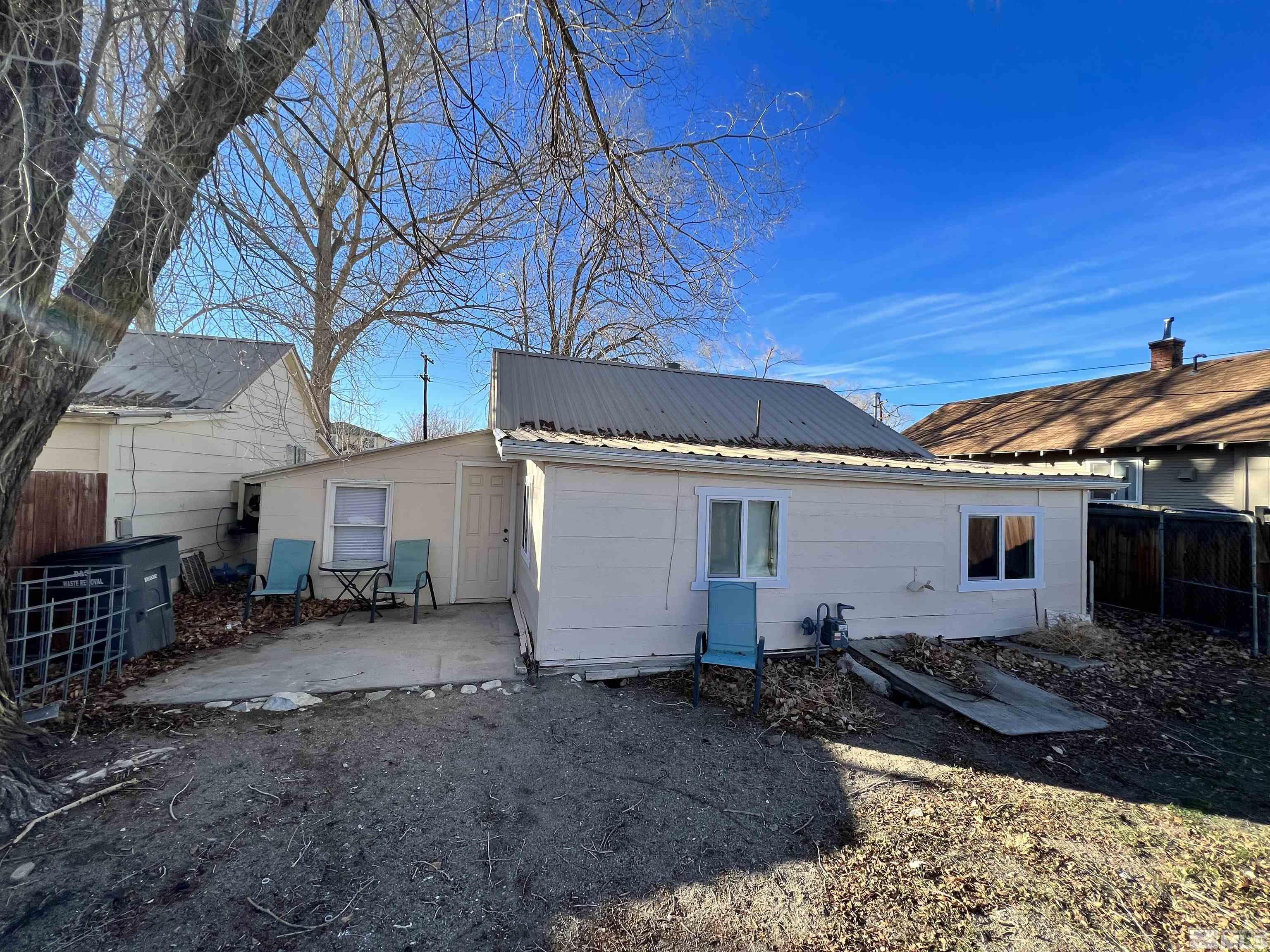 220 South Nevada Street, Unit 3 Yerington, NV 89447 - Photo 15 of 39 a view of a house with a yard