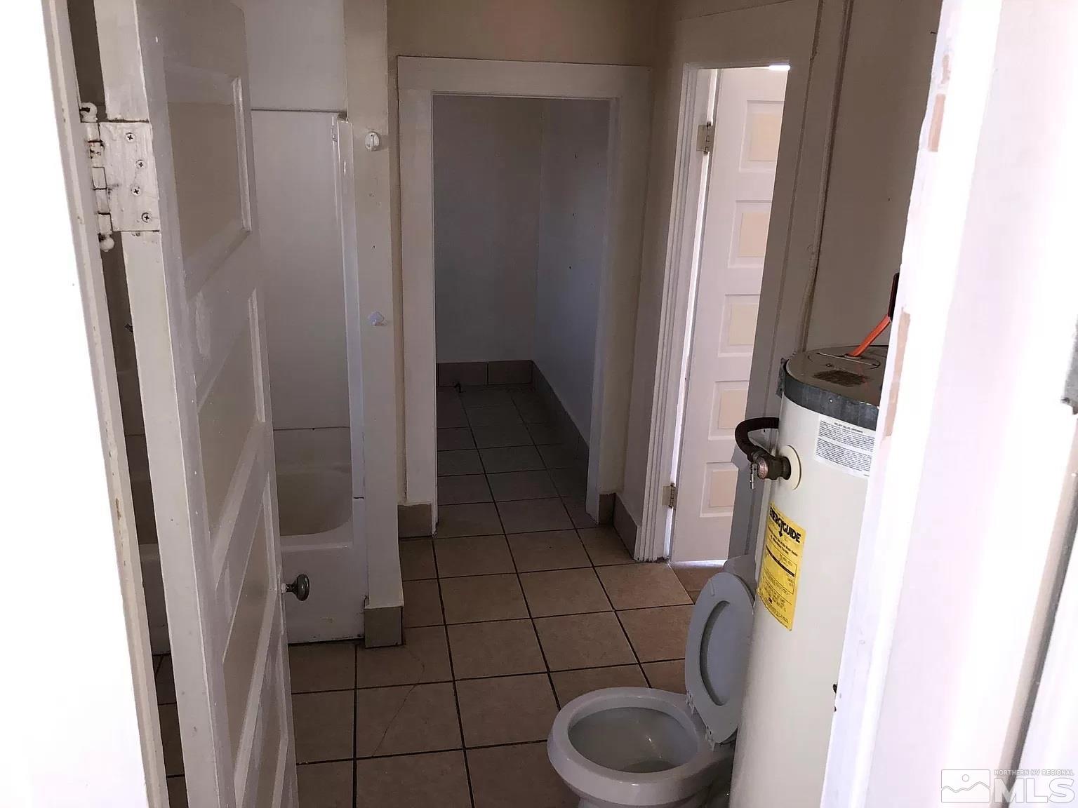 220 South Nevada Street, Unit 3 Yerington, NV 89447 - Photo 24 of 39 a bathroom with a sink and toilet