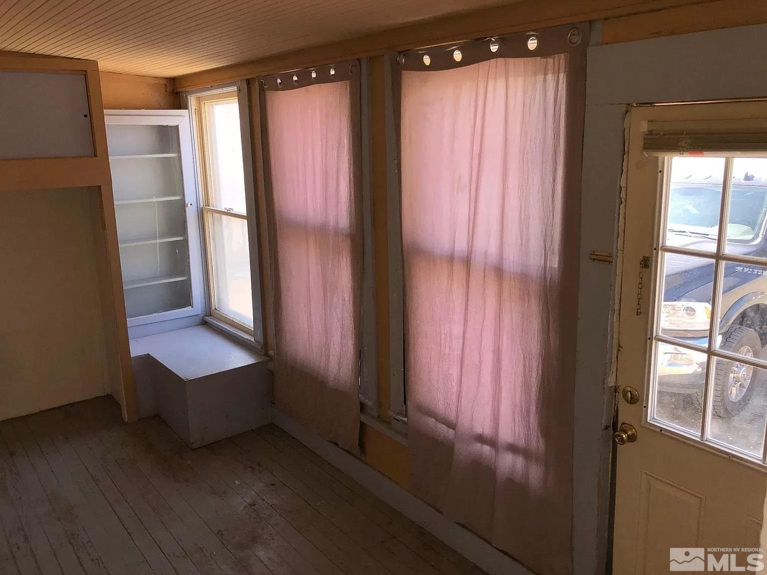 220 South Nevada Street, Unit 3 Yerington, NV 89447 - Photo 25 of 39 an empty room with windows and closet