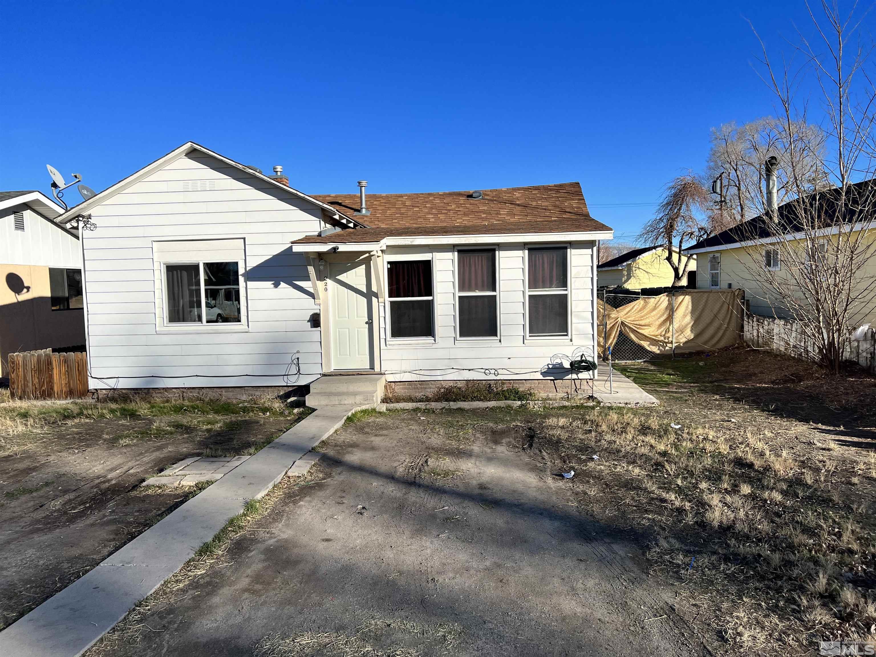 220 South Nevada Street, Unit 3 Yerington, NV 89447 - Photo 26 of 39 a view of a house with a yard