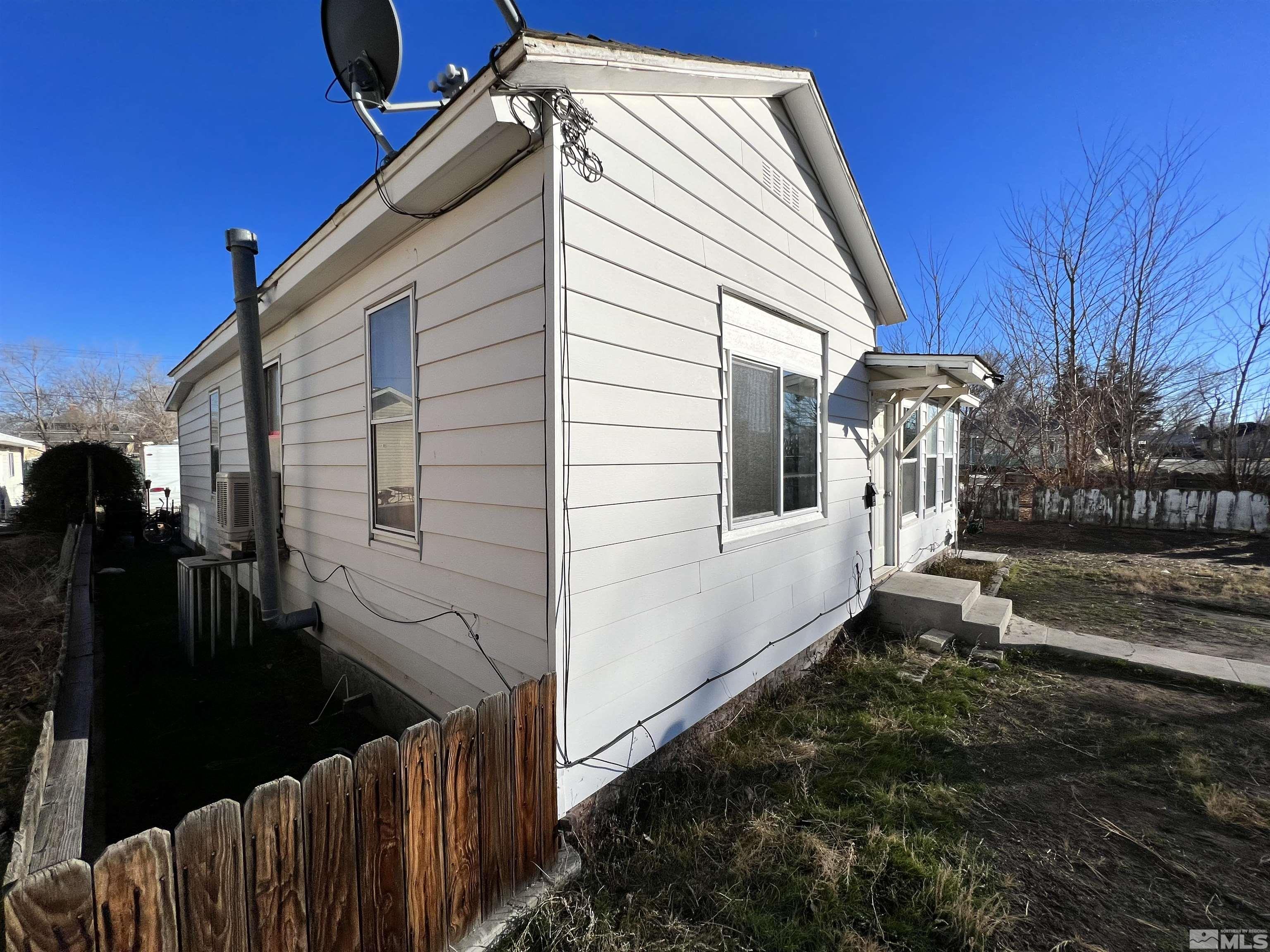 220 South Nevada Street, Unit 3 Yerington, NV 89447 - Photo 28 of 39 a view of a house with backyard and trees