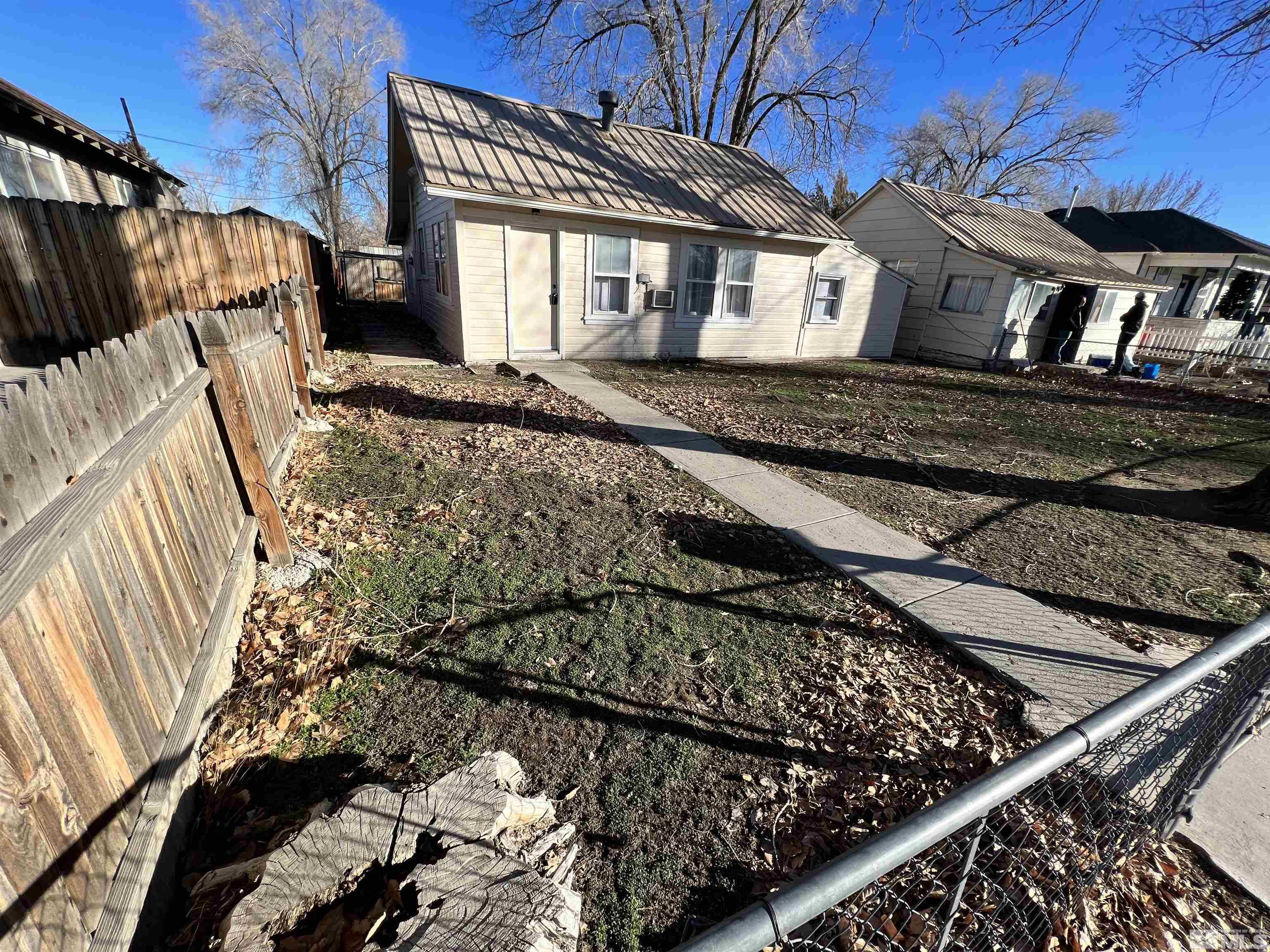 220 South Nevada Street, Unit 3 Yerington, NV 89447 - Photo 3 of 39 a view of a house with a wooden deck