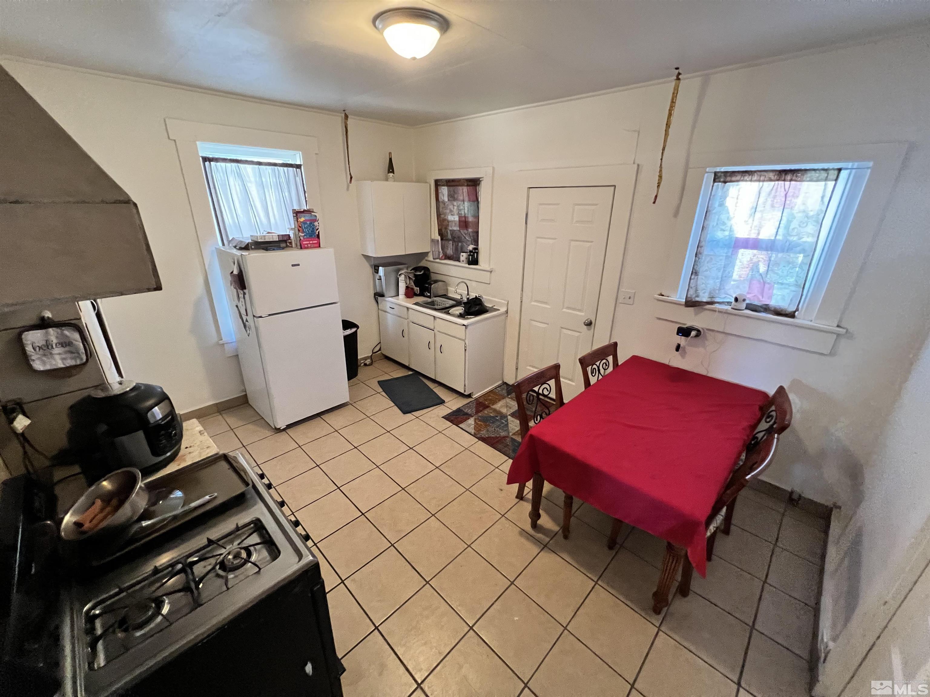 220 South Nevada Street, Unit 3 Yerington, NV 89447 - Photo 31 of 39 a room with furniture a rug and gym equipment