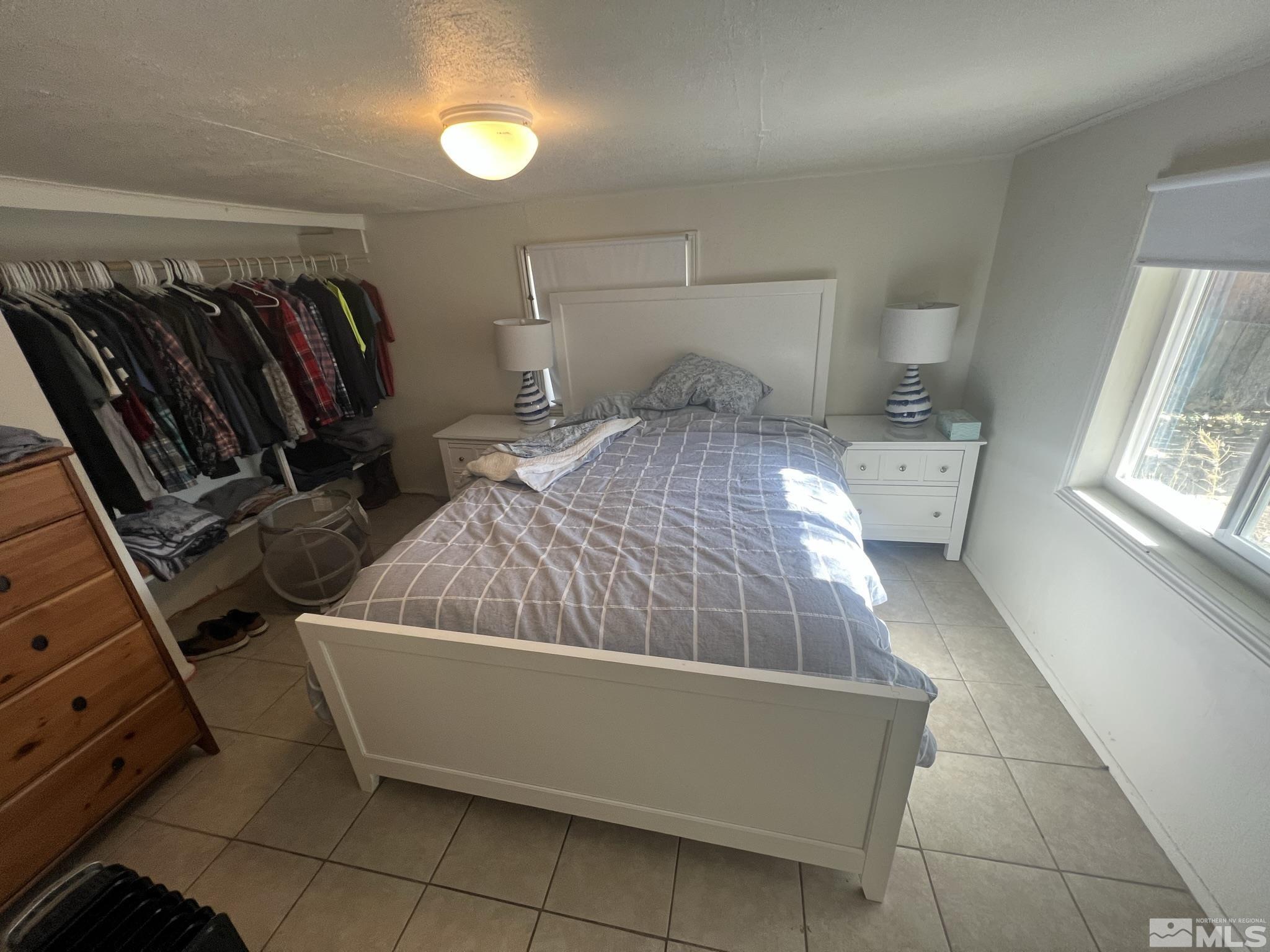 220 South Nevada Street, Unit 3 Yerington, NV 89447 - Photo 37 of 39 a bedroom with a bed and window