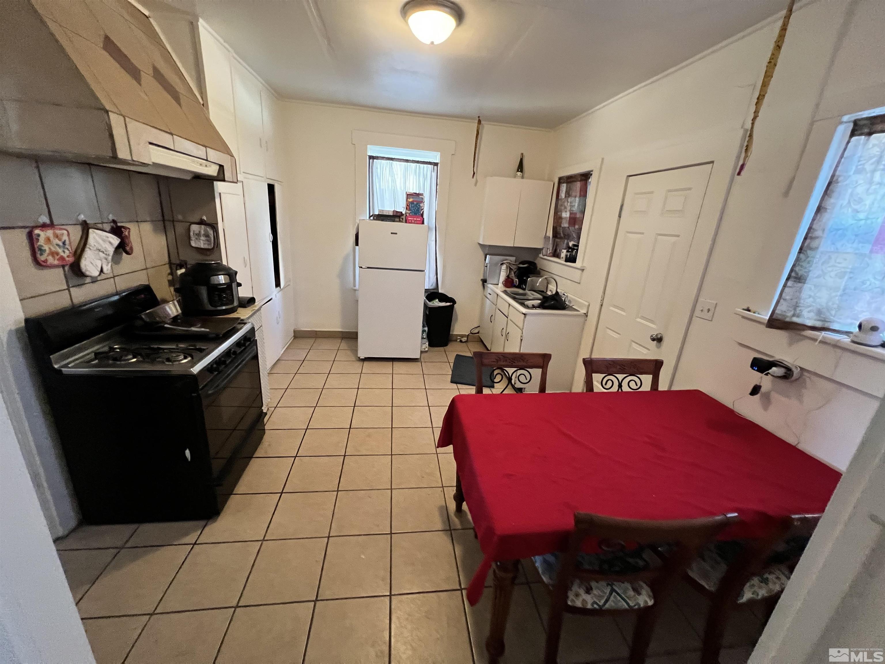 220 South Nevada Street, Unit 3 Yerington, NV 89447 - Photo 7 of 39 a view of kitchen with refrigerator stove and sink