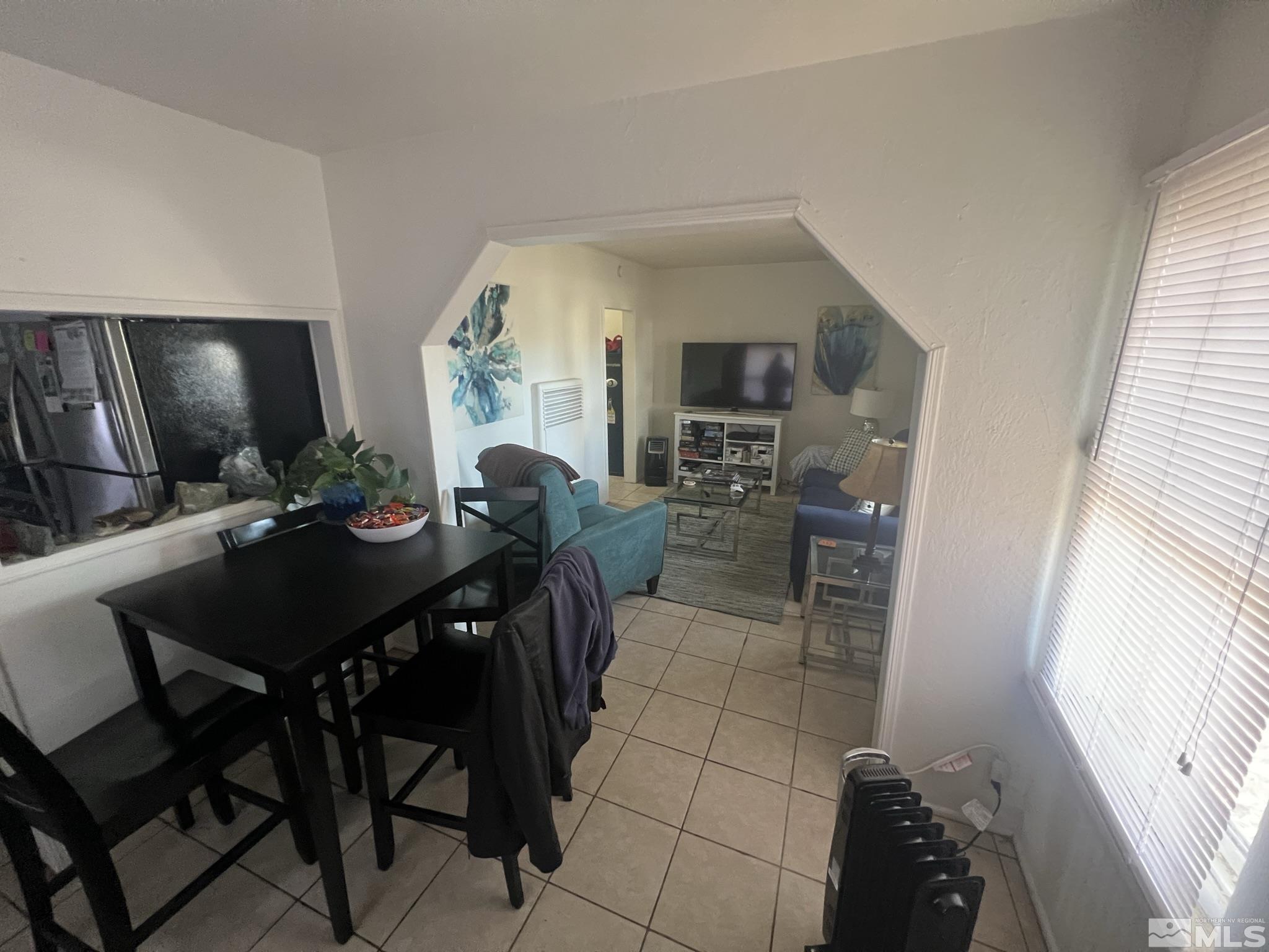 220 South Nevada Street, Unit 3 Yerington, NV 89447 - Photo 10 of 39 a view of a dining room with furniture and a window