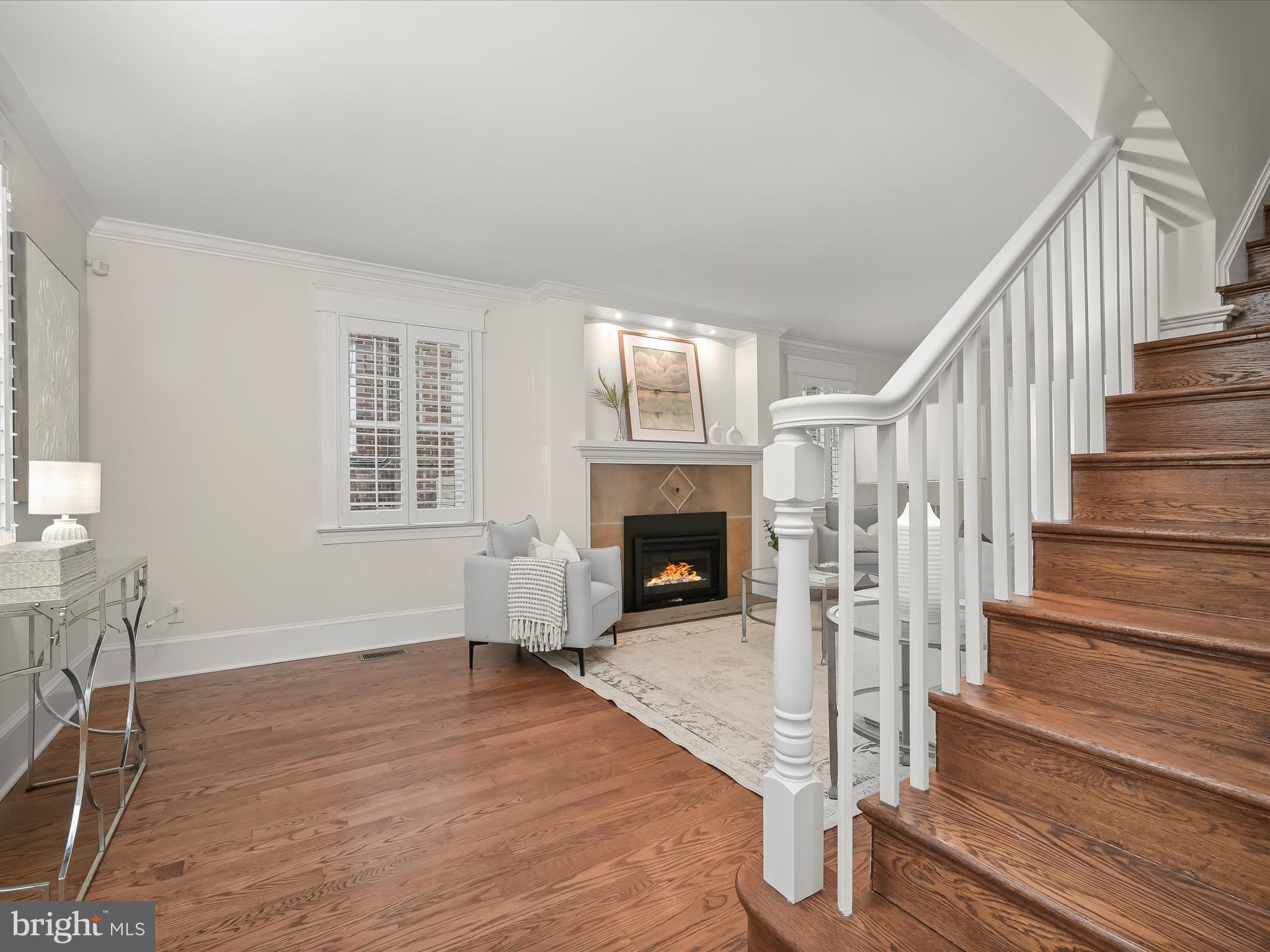 3118 17th Street North Arlington, VA 22201 - Photo 16 of 96 a view of a livingroom with wooden floor and a fireplace