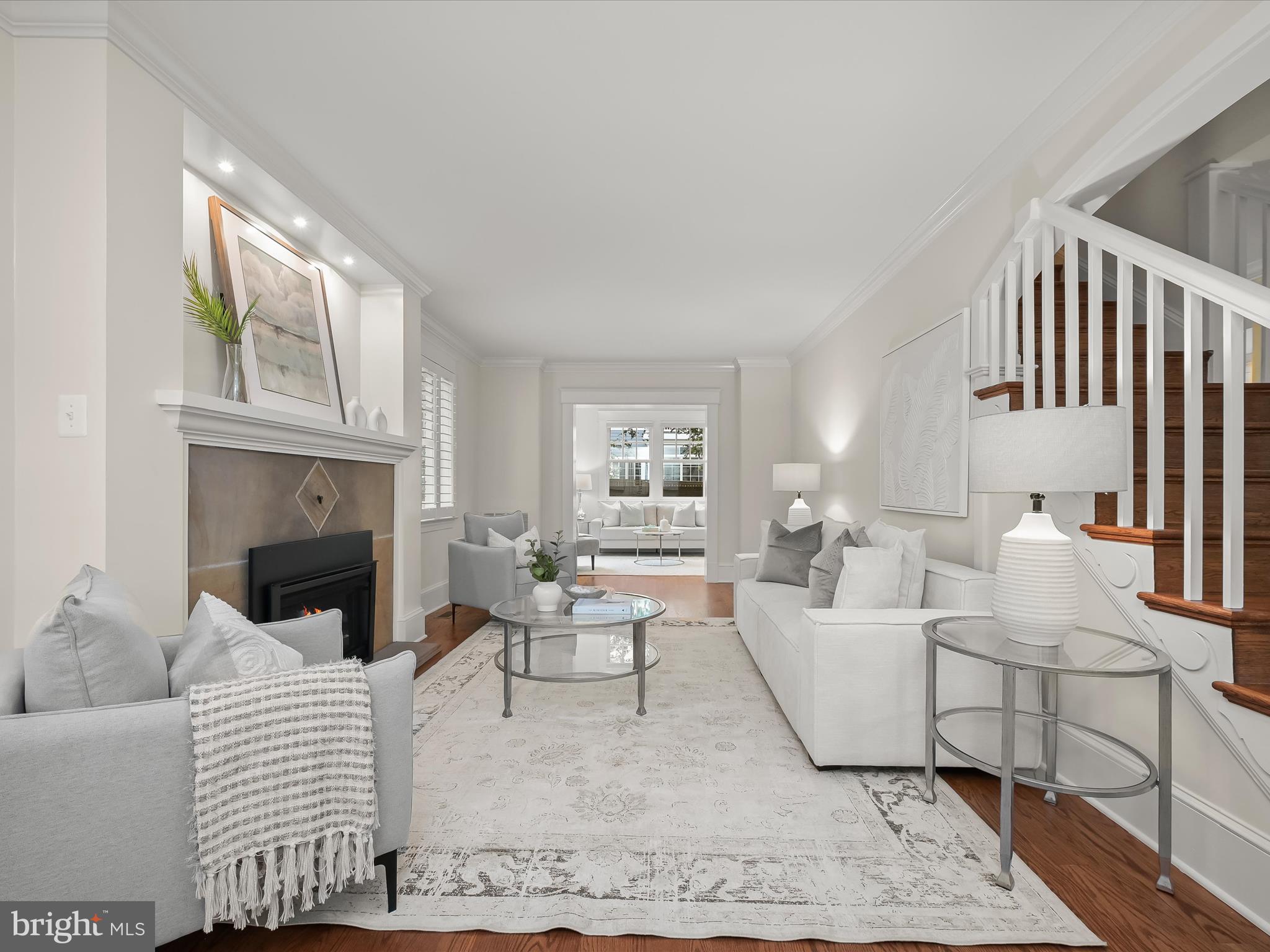 3118 17th Street North Arlington, VA 22201 - Photo 17 of 96 a living room with furniture a fireplace and a table