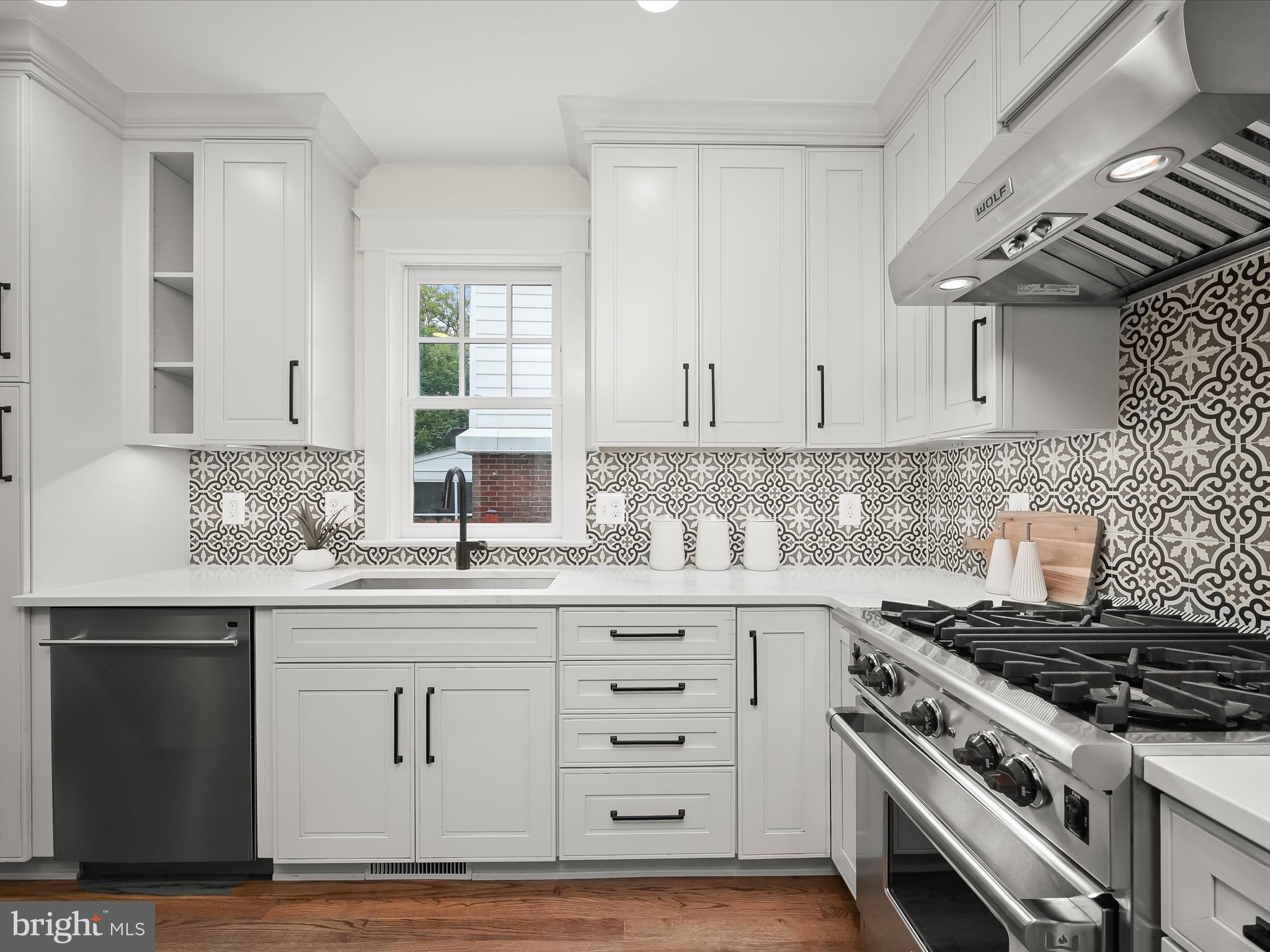 3118 17th Street North Arlington, VA 22201 - Photo 22 of 96 a kitchen with granite countertop a stove and a sink