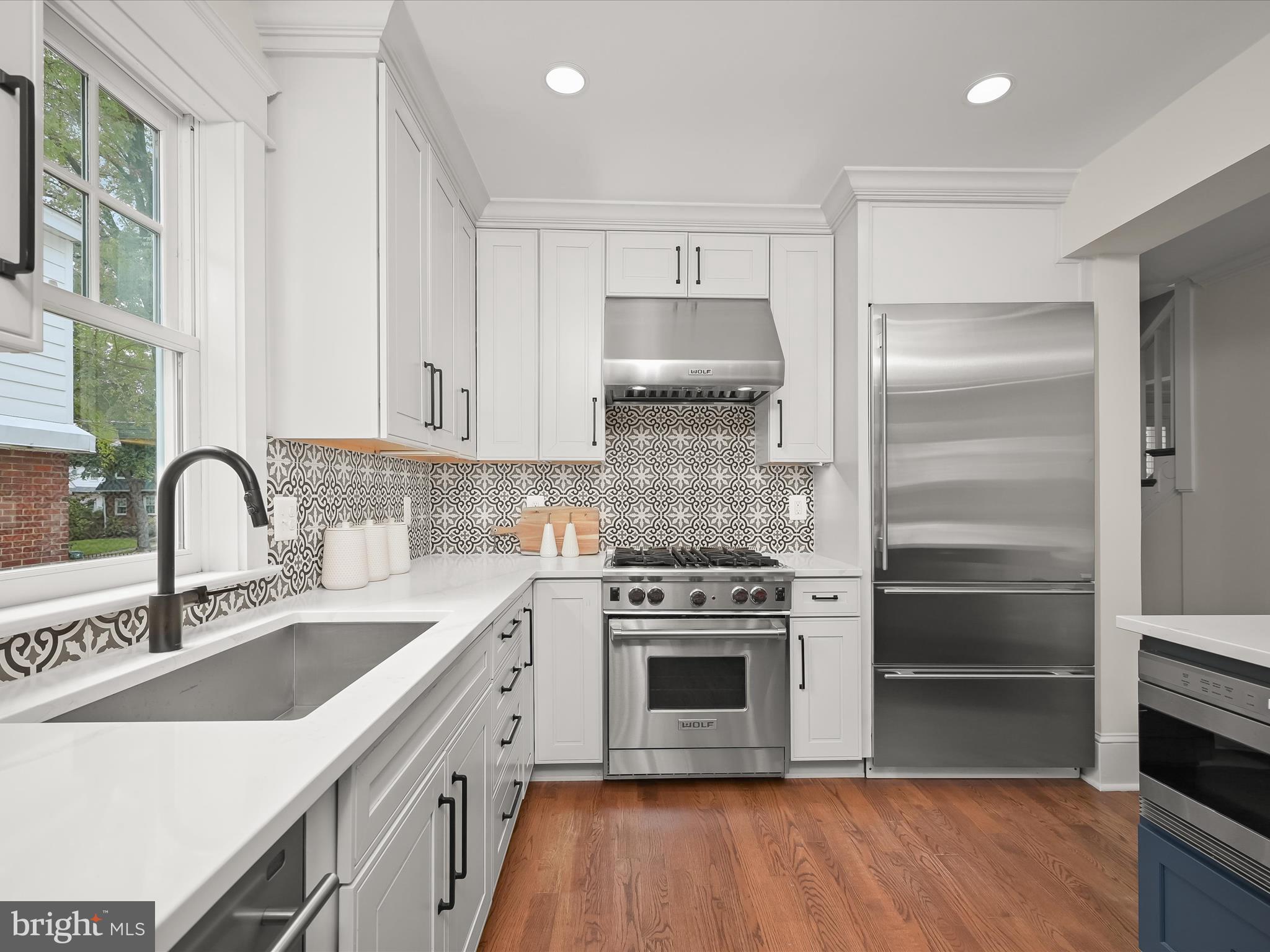 3118 17th Street North Arlington, VA 22201 - Photo 23 of 96 a kitchen with stainless steel appliances granite countertop a sink stove and refrigerator